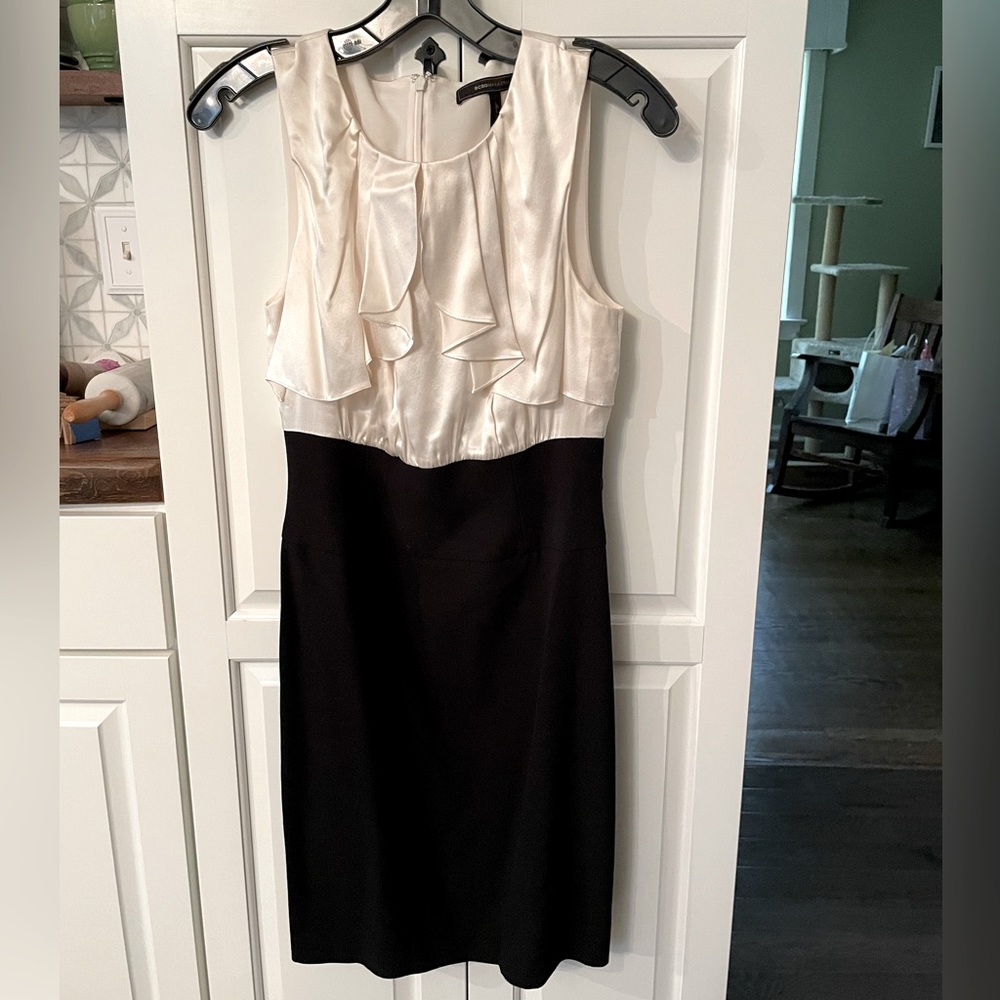 New without tags BCBG Maxazria dress. Black bottom and cream top.
